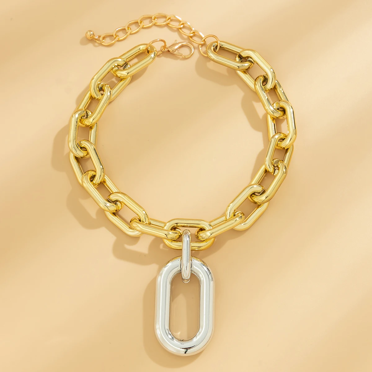 Collier chaîne et breloque bicolore